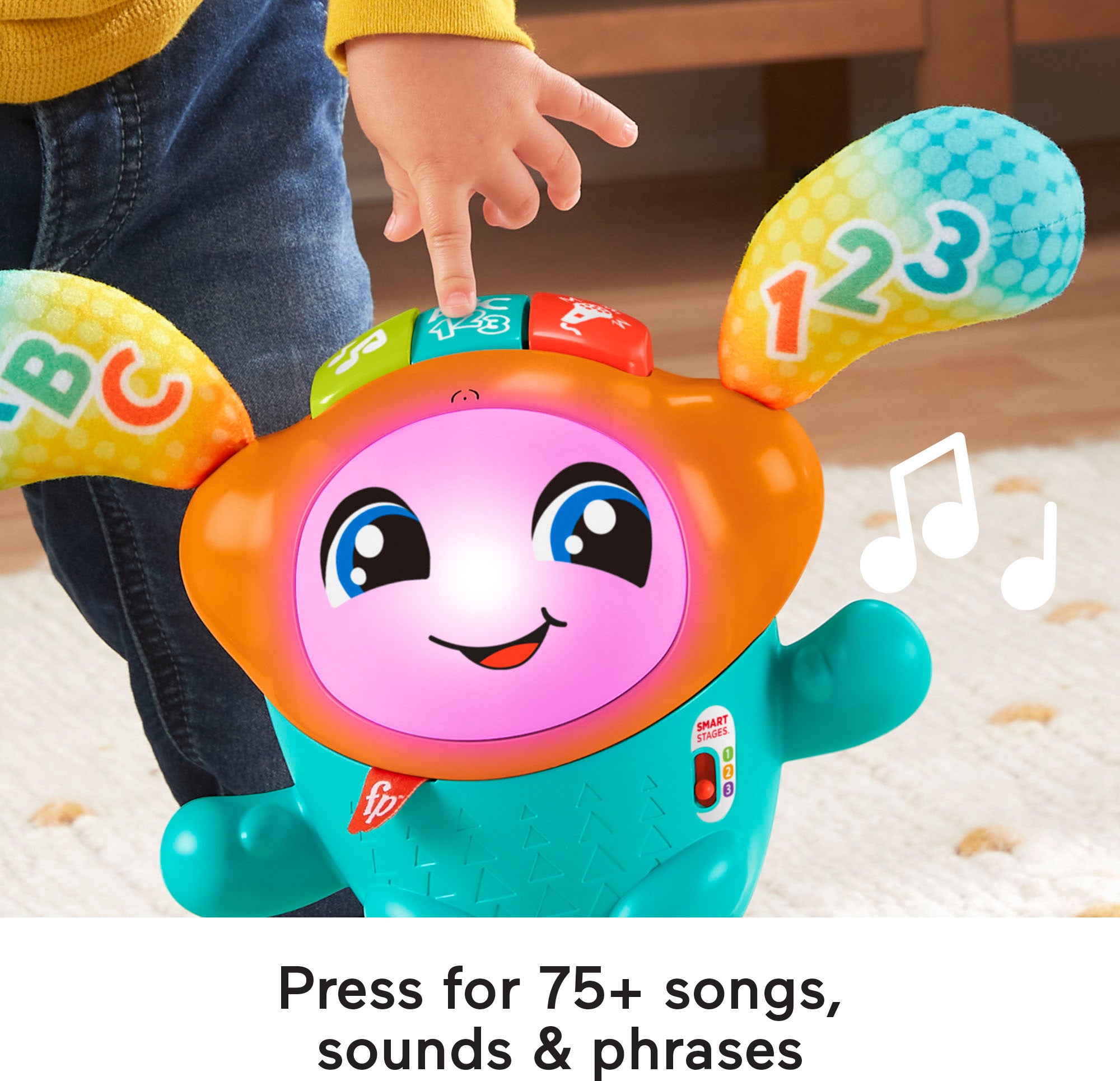 Toddler playing with Fisher-Price DJ Bouncin’ Beats
