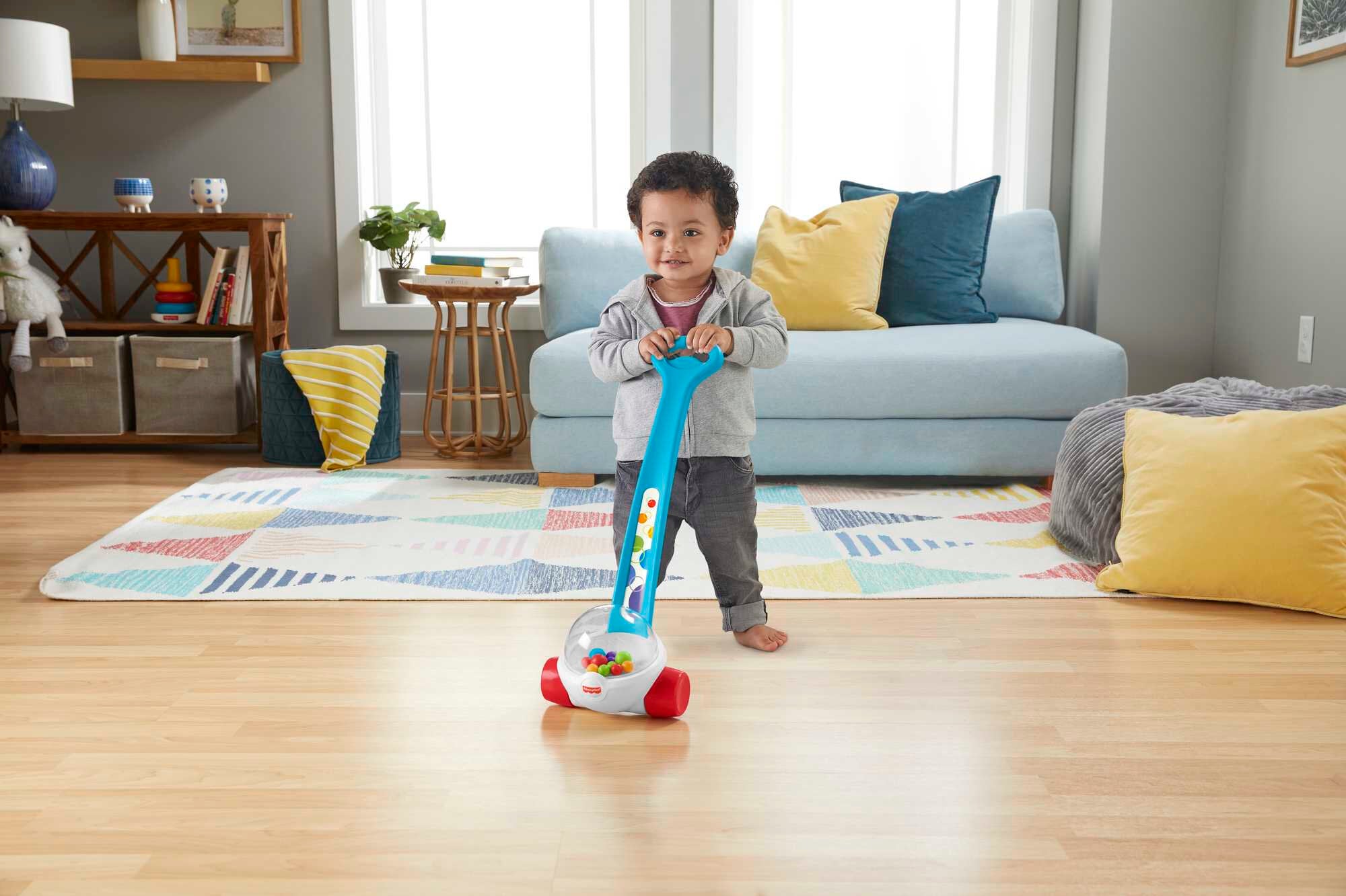 Close-up of Fisher-Price ball-popping push toy in action
