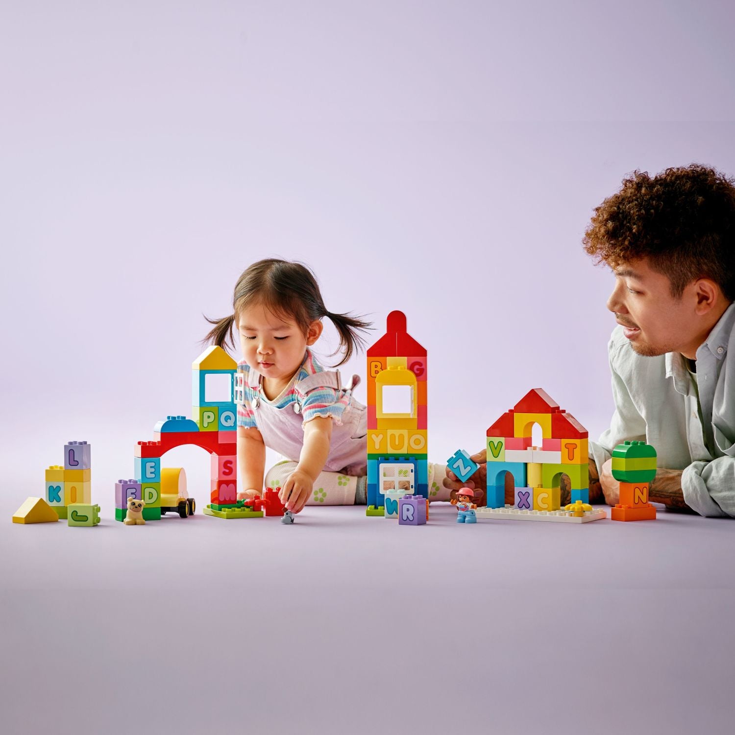 Drivable DUPLO toy car with boy, girl, and dog figures
