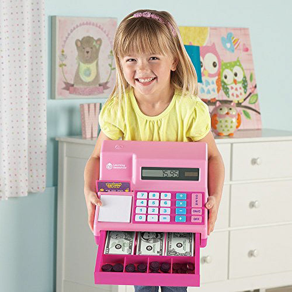 Kids using the solar-powered calculator cash register.
