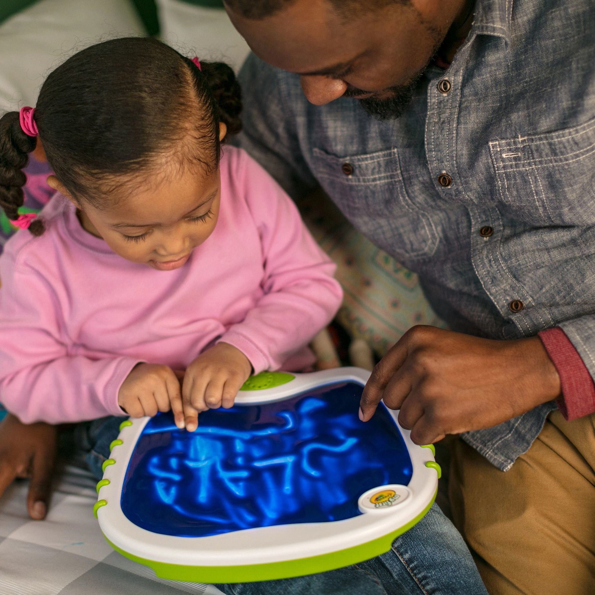 Close-up of the Crayola Touch Lights doodle board with vibrant colors.
