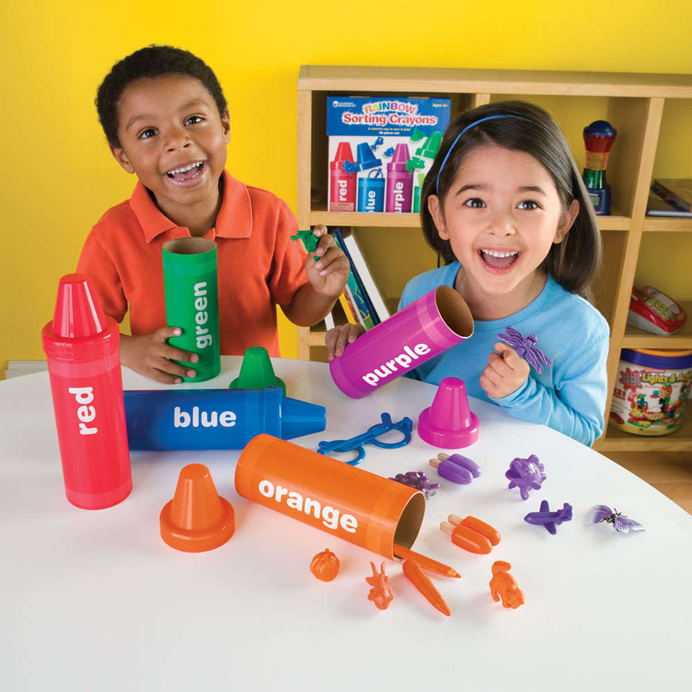 Hands-on color matching activity with crayon-shaped sorting tubes
